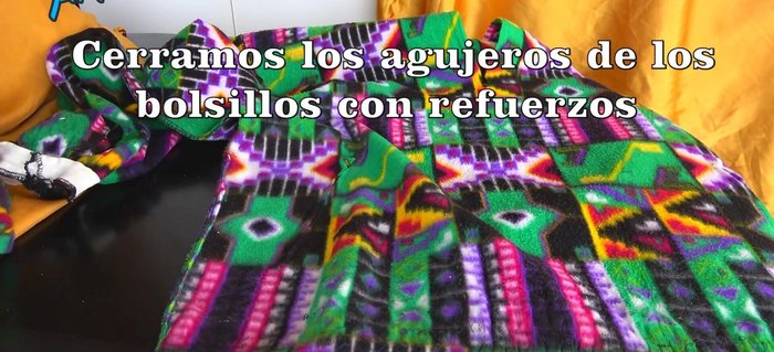 Reforzar los agujeros que quedaron donde estaban los bolsillos con una tela por debajo.